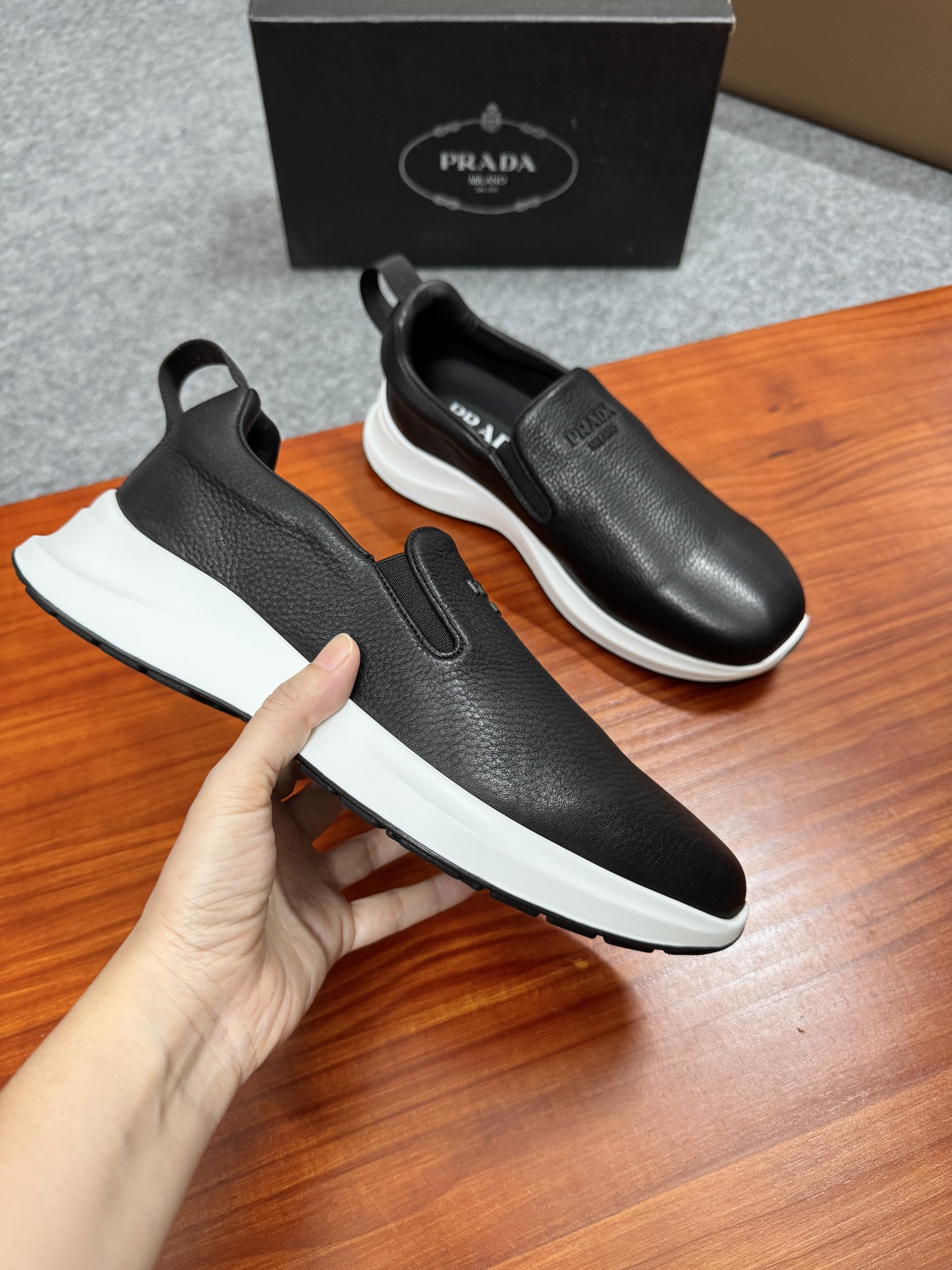 Prada Men's Black Leather Slip-On Sneakers With White Ultra-Light Sole 4 i1755596536842 40 0 2