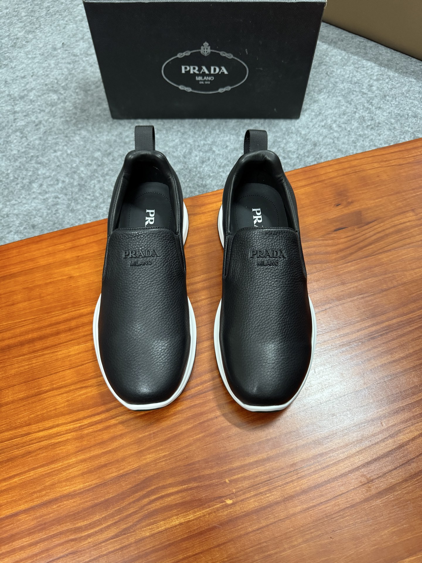 Prada Men's Black Leather Slip-On Sneakers With White Ultra-Light Sole 1 i1755596548576 8536 0 0