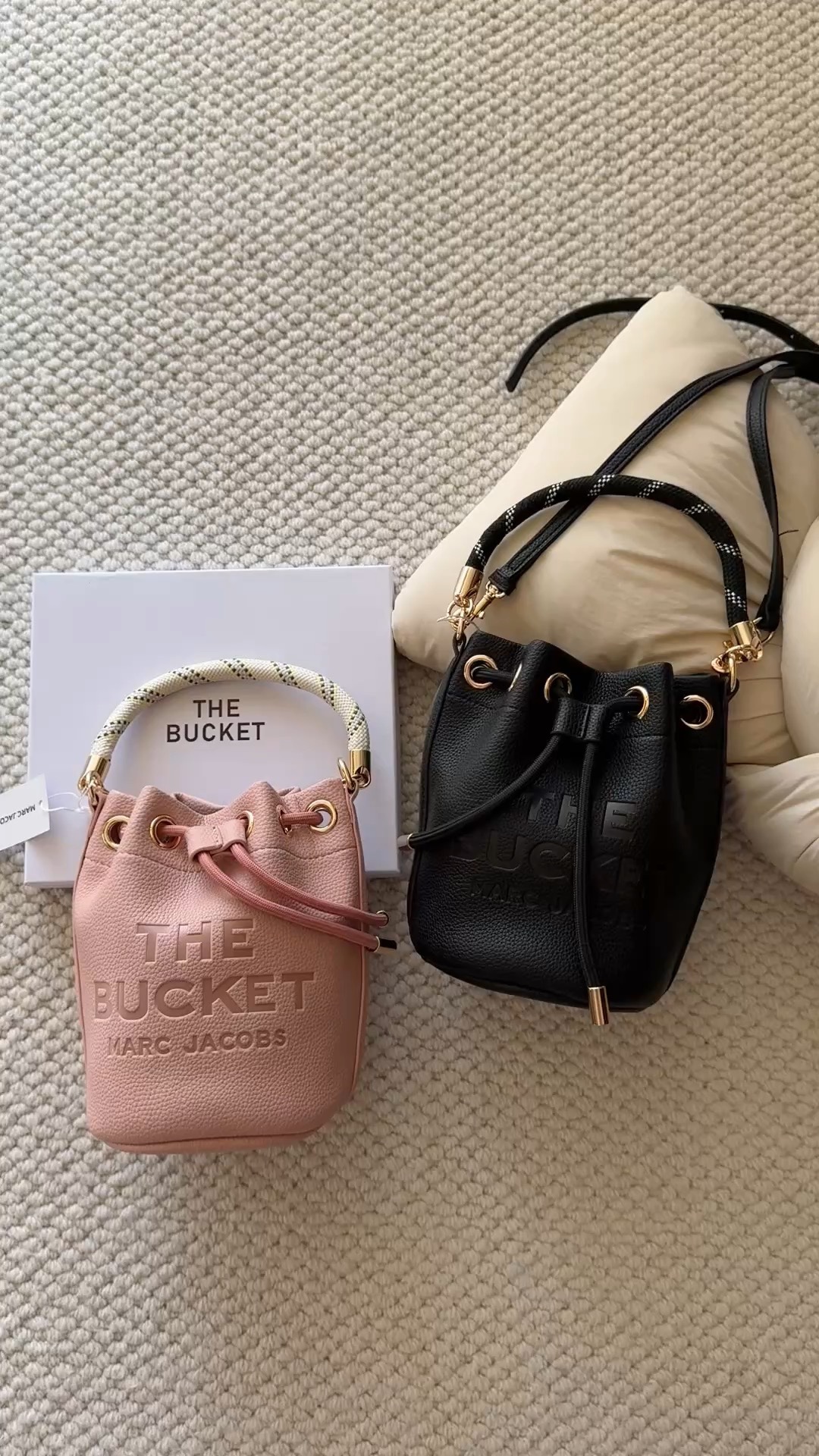 This compact mini leather bucket bag features an embossed logo and a - Bag