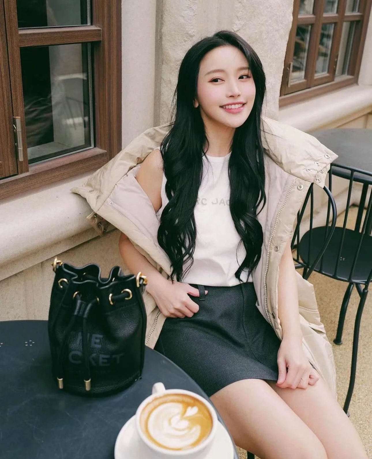 A compact bucket bag designed for top-handle or crossbody wear, offering - Bag 2