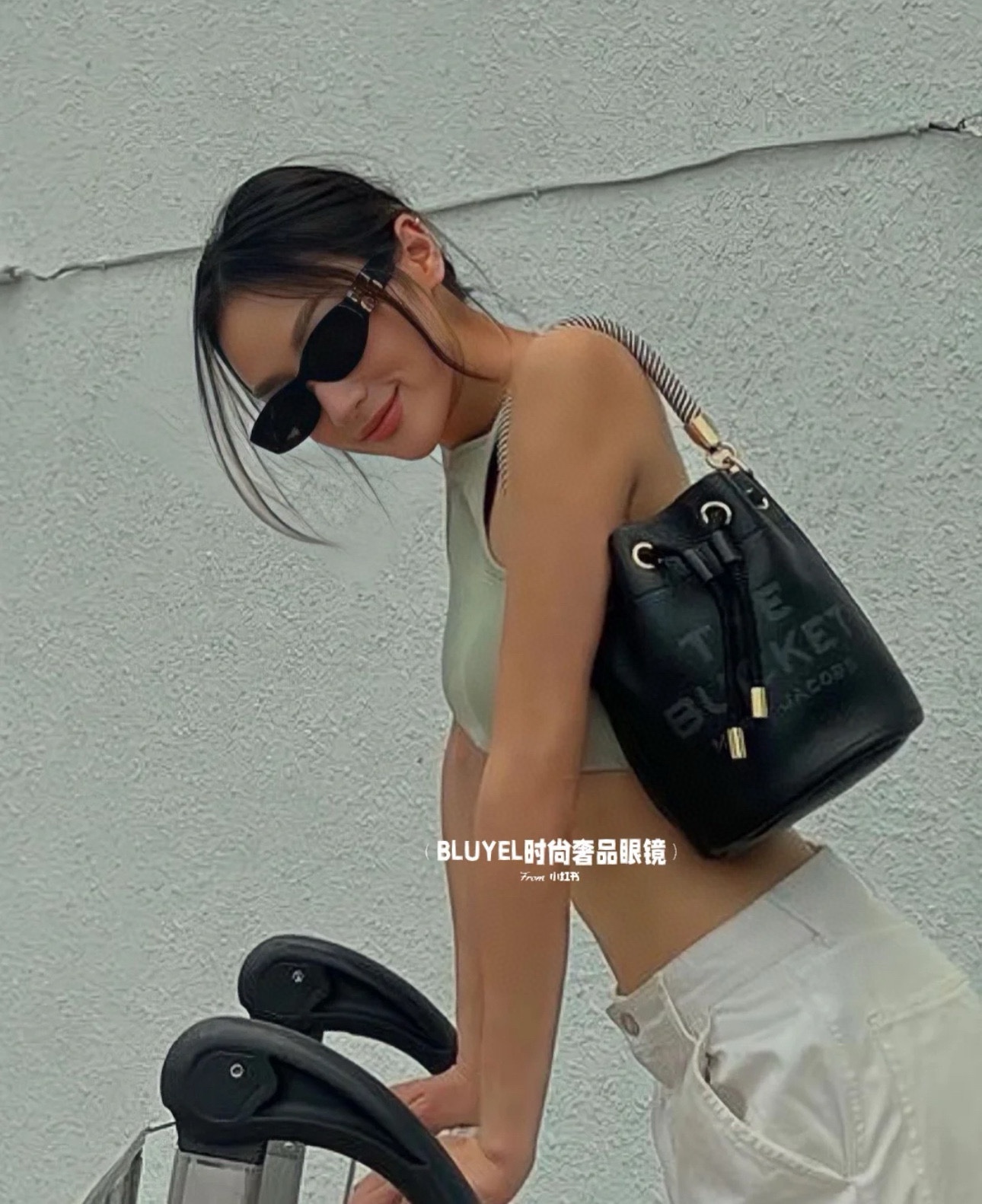 A compact bucket bag designed for top-handle or crossbody wear, offering - Bag 5