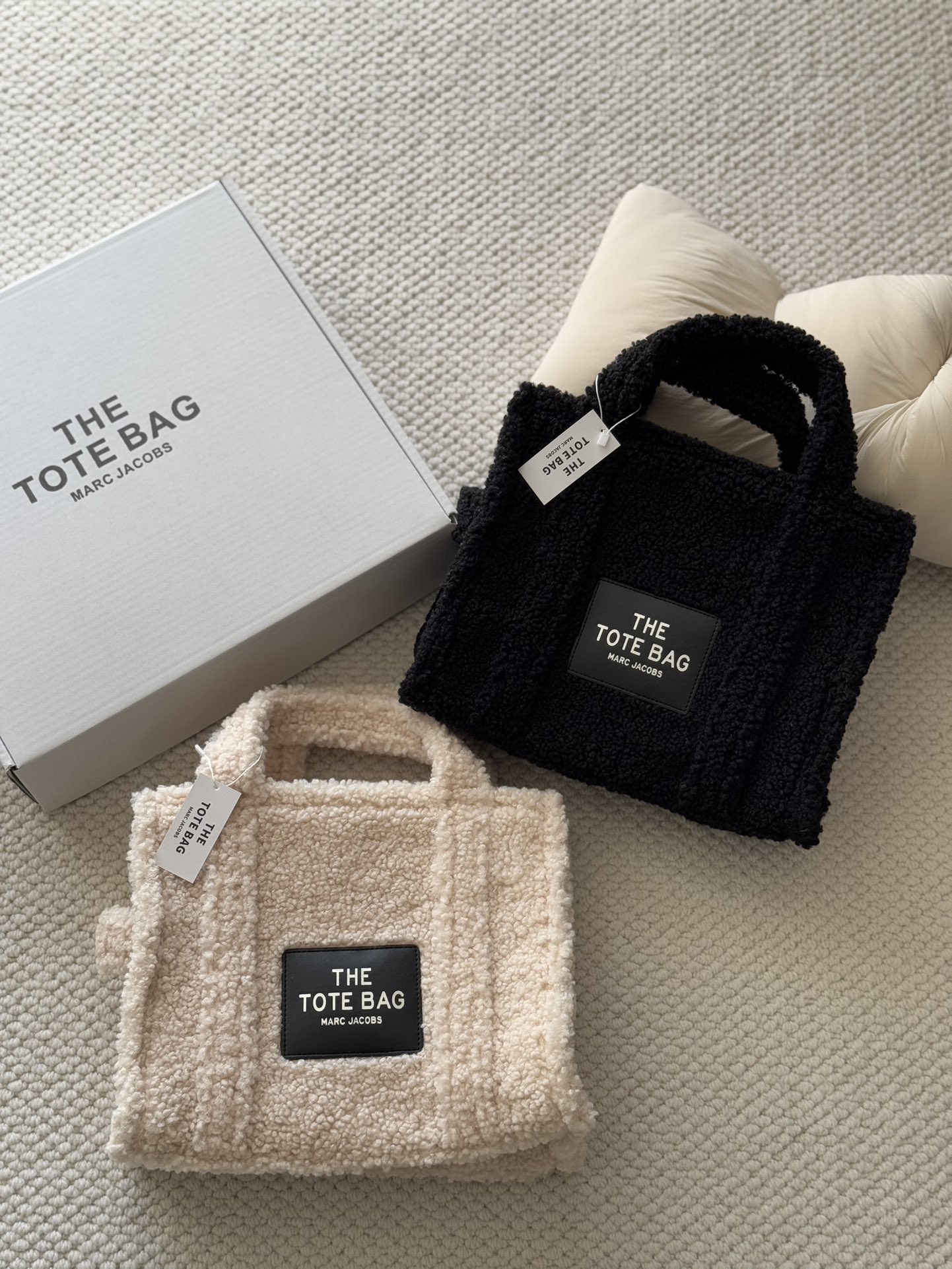 Crafted from soft, fine-textured shearling, this winter tote features a - Bag