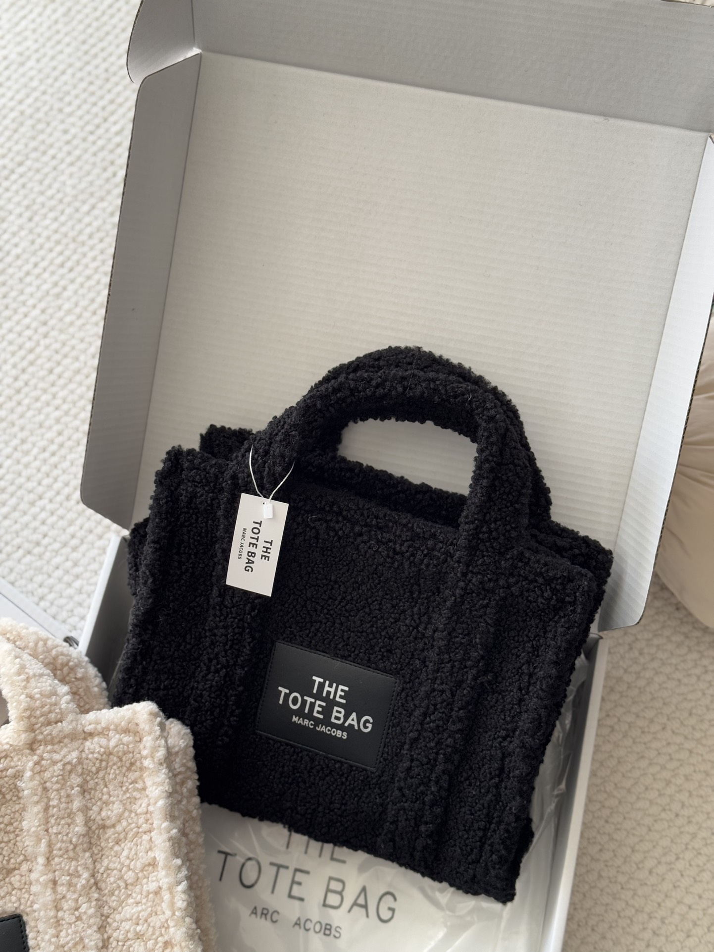 Crafted from soft, fine-textured shearling, this winter tote features a - Bag 4