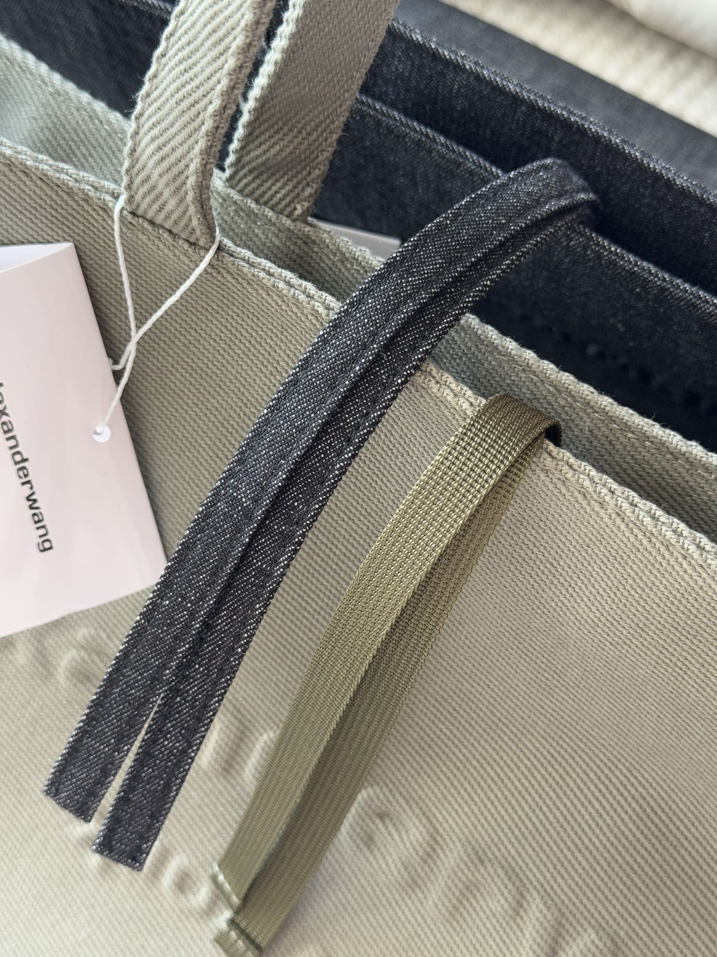 Classic tote silhouette with an inverted trapezoid structure, wider at - Comprehensive