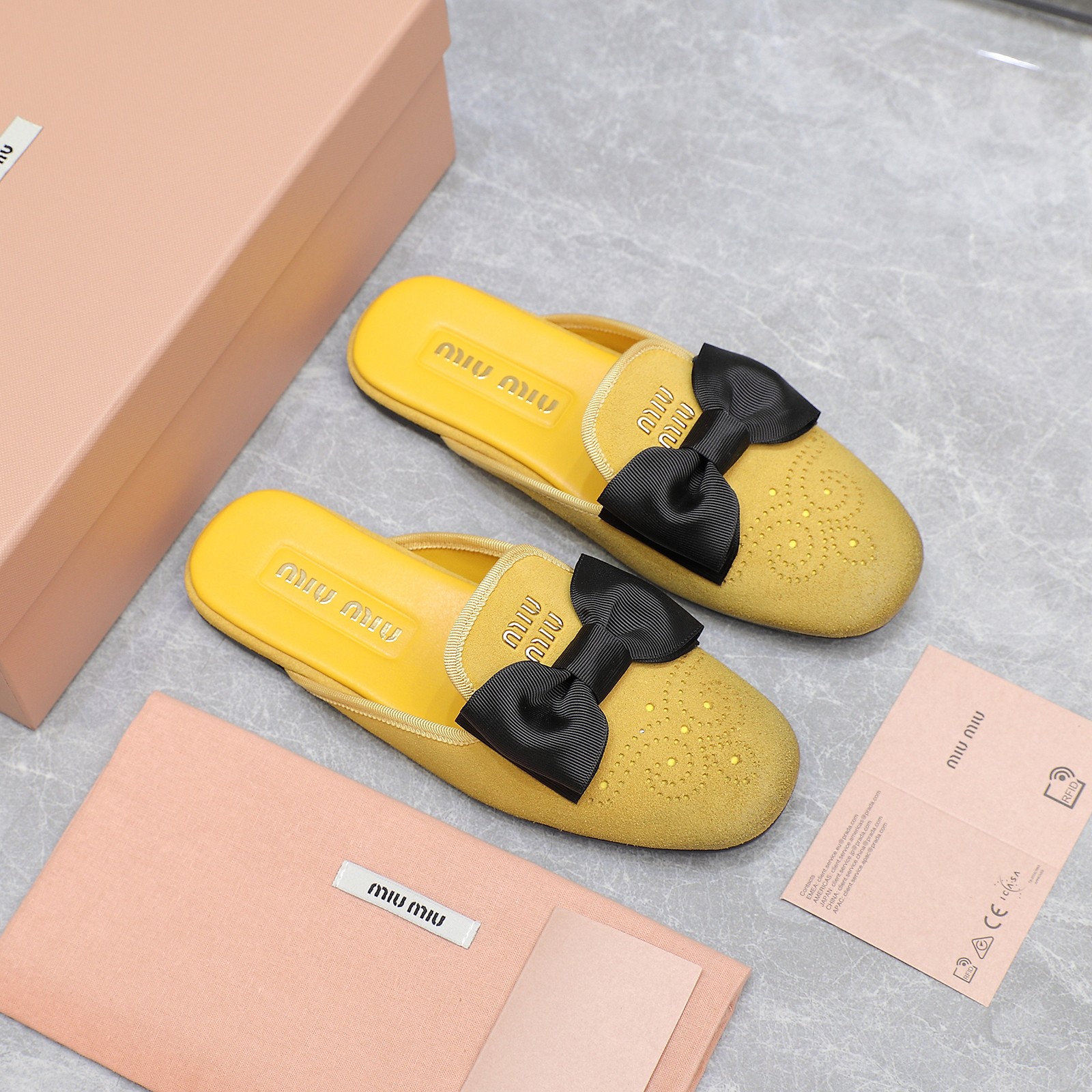 Miu Miu Bow-Embellished Suede Loafer Mules - Elegant and Comfortable