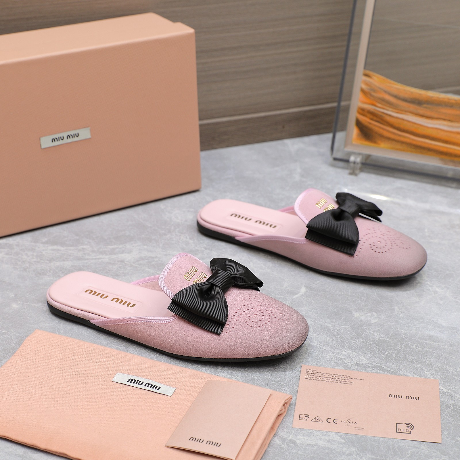 Miu Miu Bow-Embellished Leather Loafer Mules with Scalloped Perforations 5 a1736428776874 0068