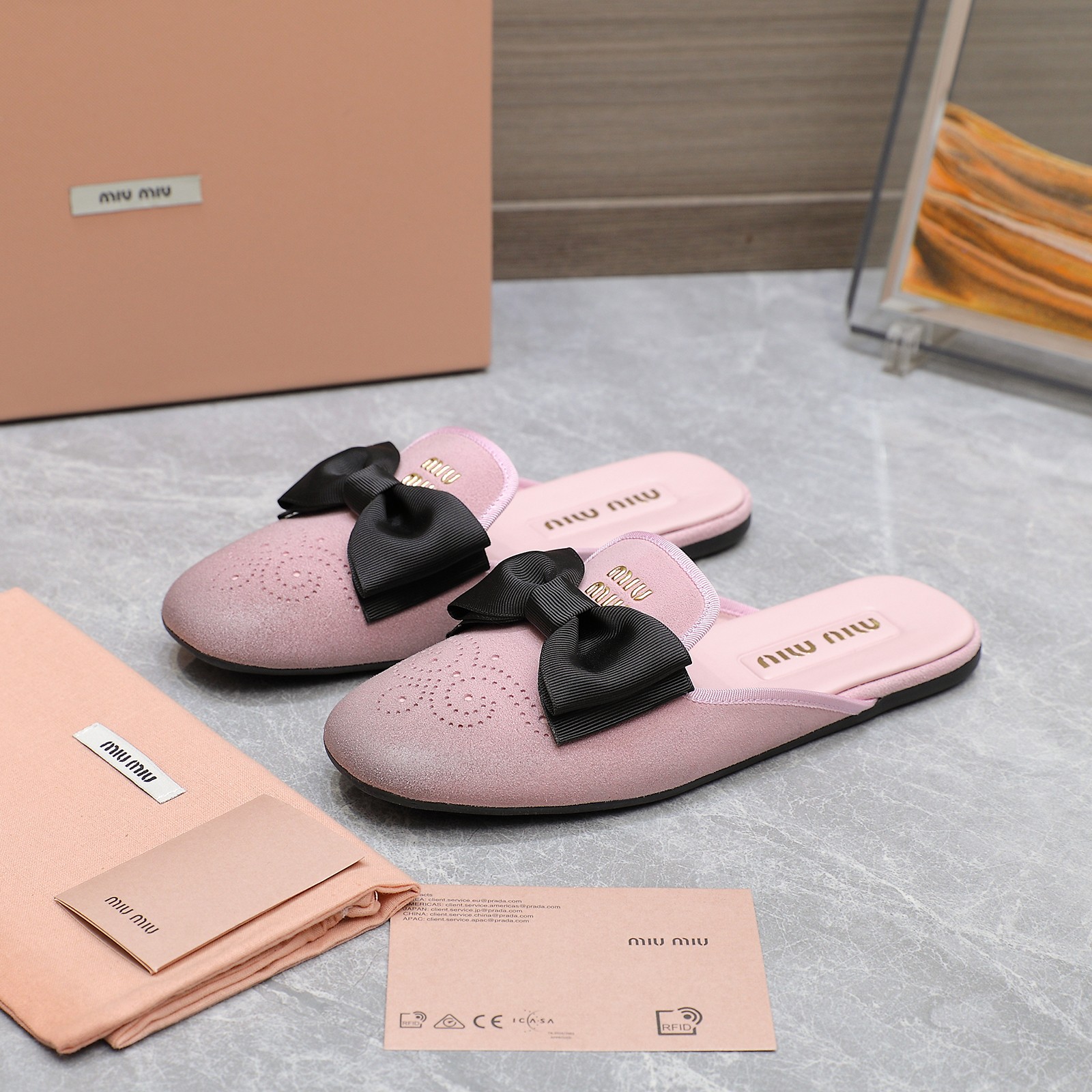 Miu Miu Bow-Embellished Leather Loafer Mules with Scalloped Perforations 4 a1736428776920 3142