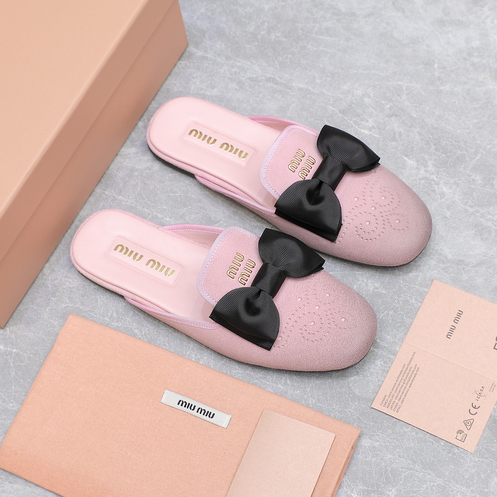 Miu Miu Bow-Embellished Leather Loafer Mules with Scalloped Perforations 2 a1736428776950 7317