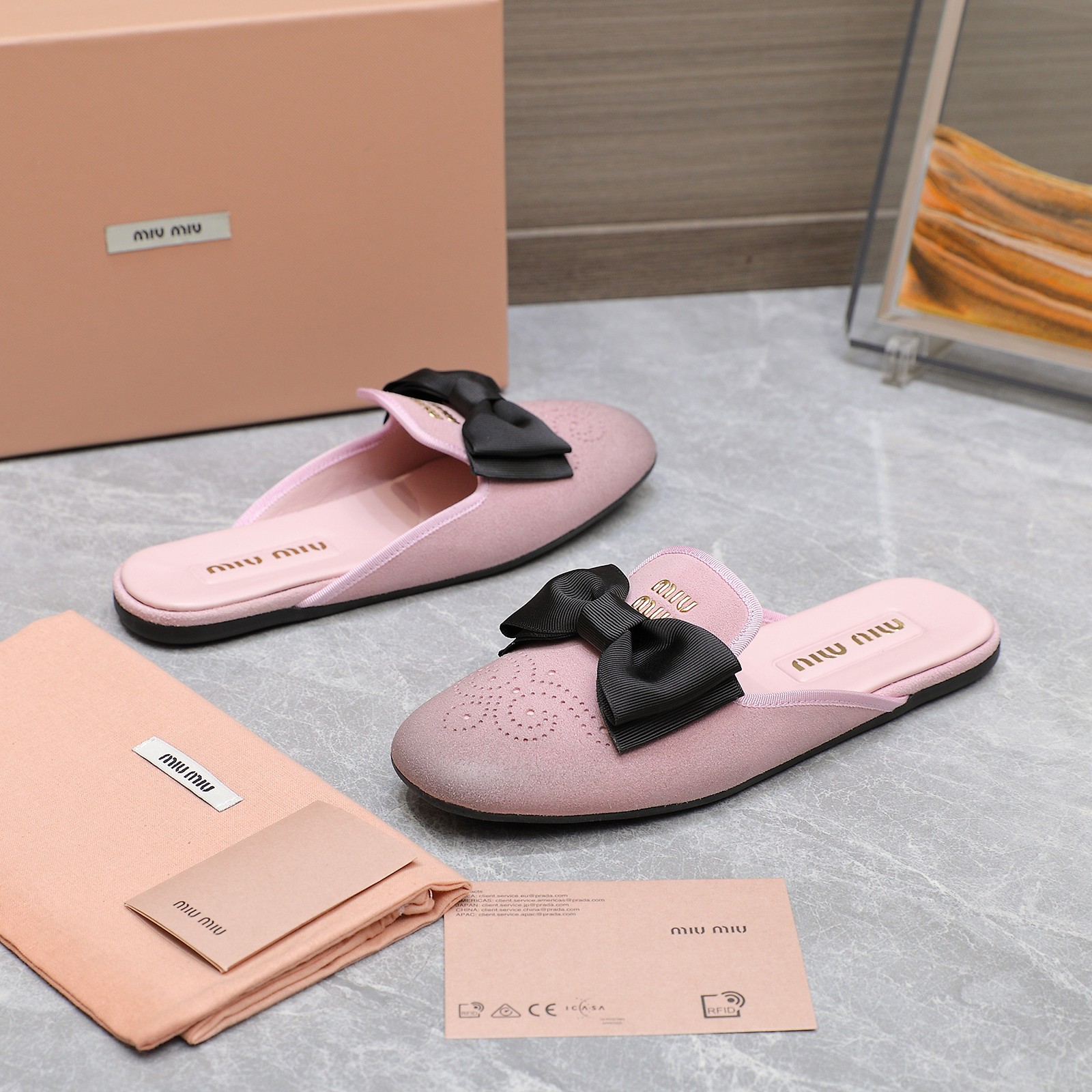 Miu Miu Bow-Embellished Leather Loafer Mules with Scalloped Perforations 10 a1736428778736 7728