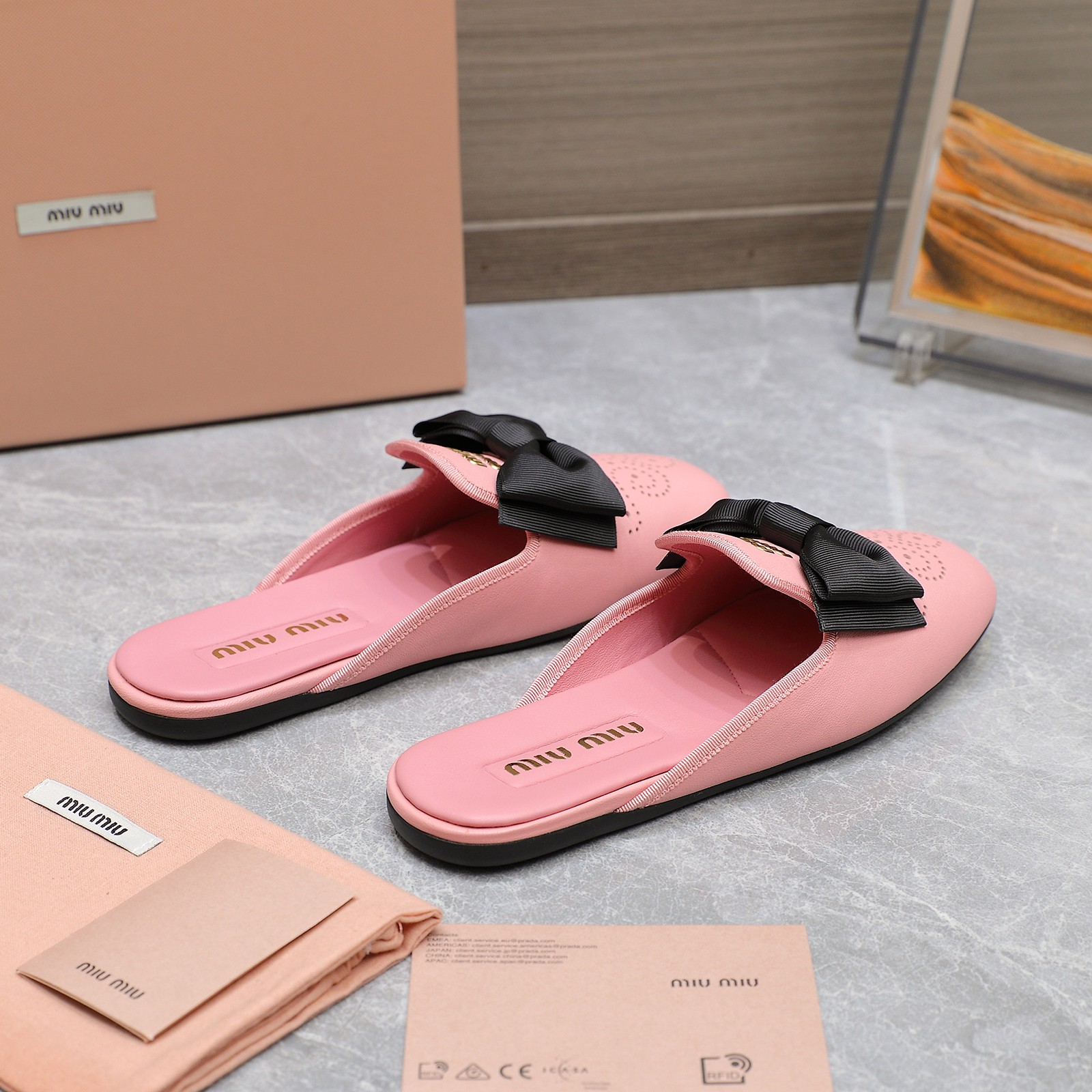 Miu Miu Bow-Embellished Perforated Leather Loafer Mules, Spring/Summer Collection 5 a1736428802440 8575