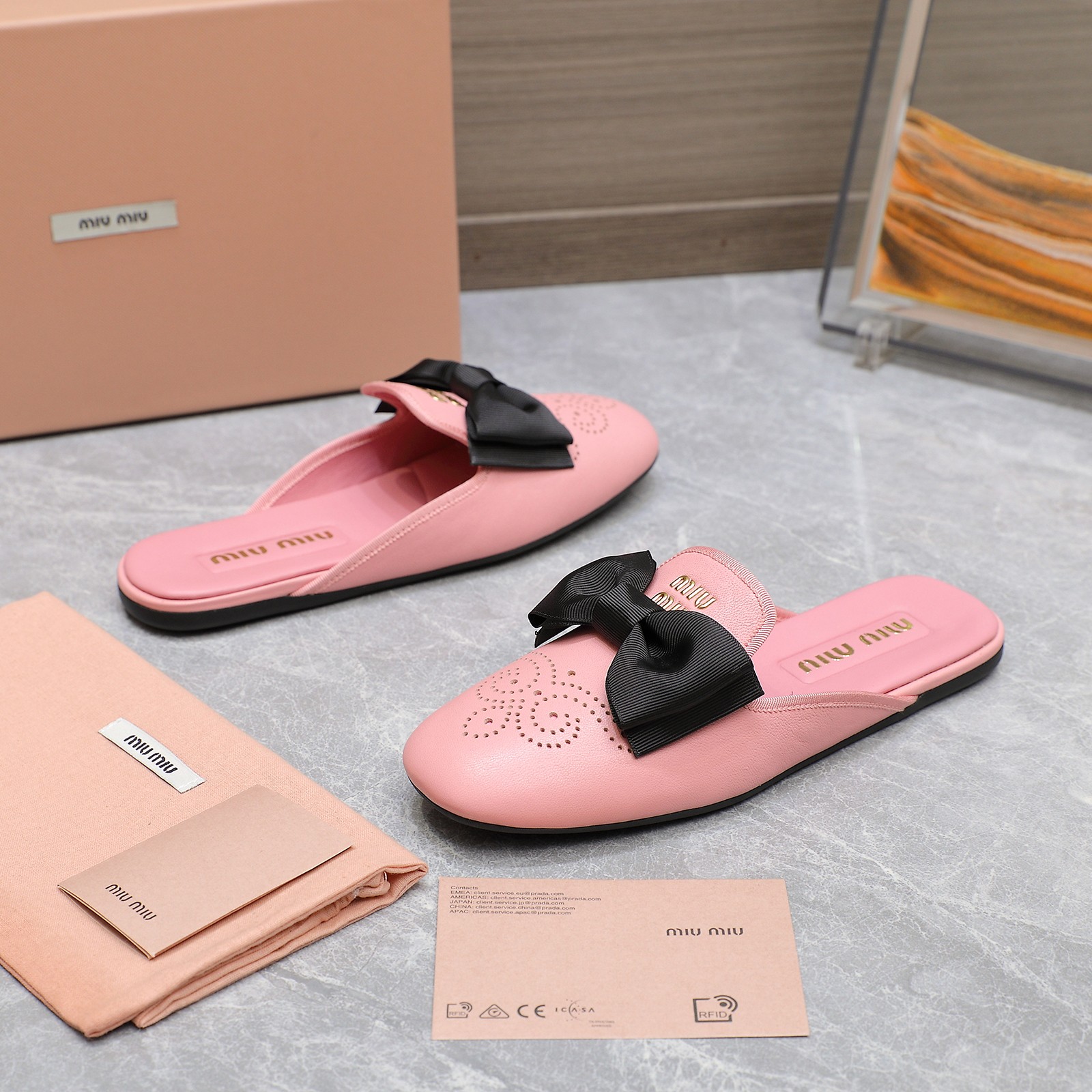 Miu Miu Bow-Embellished Perforated Leather Loafer Mules, Spring/Summer Collection 9 a1736428802483 4737