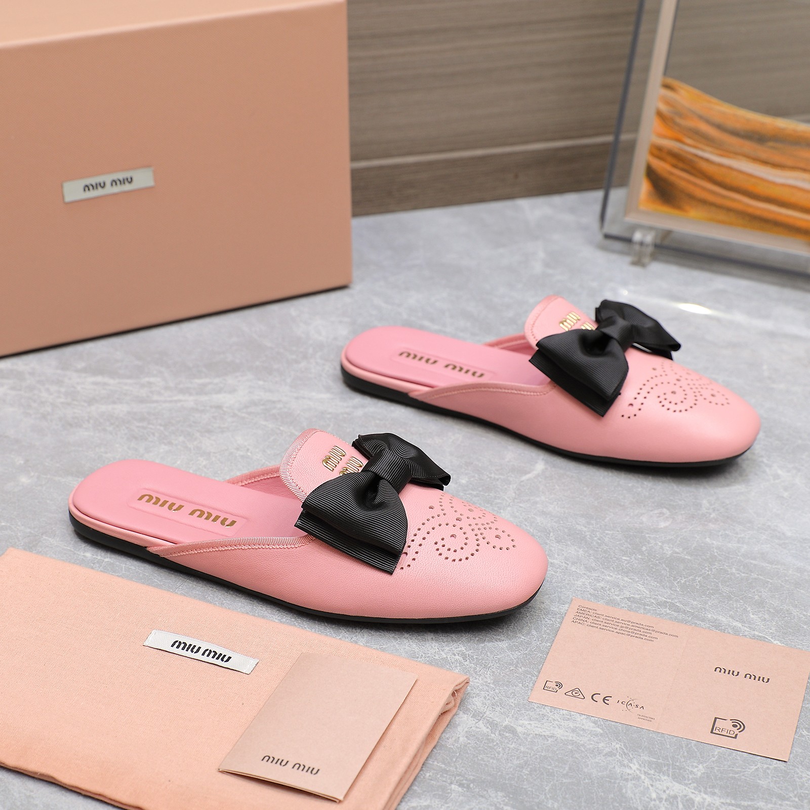 Miu Miu Bow-Embellished Perforated Leather Loafer Mules, Spring/Summer Collection 4 a1736428804469 2621