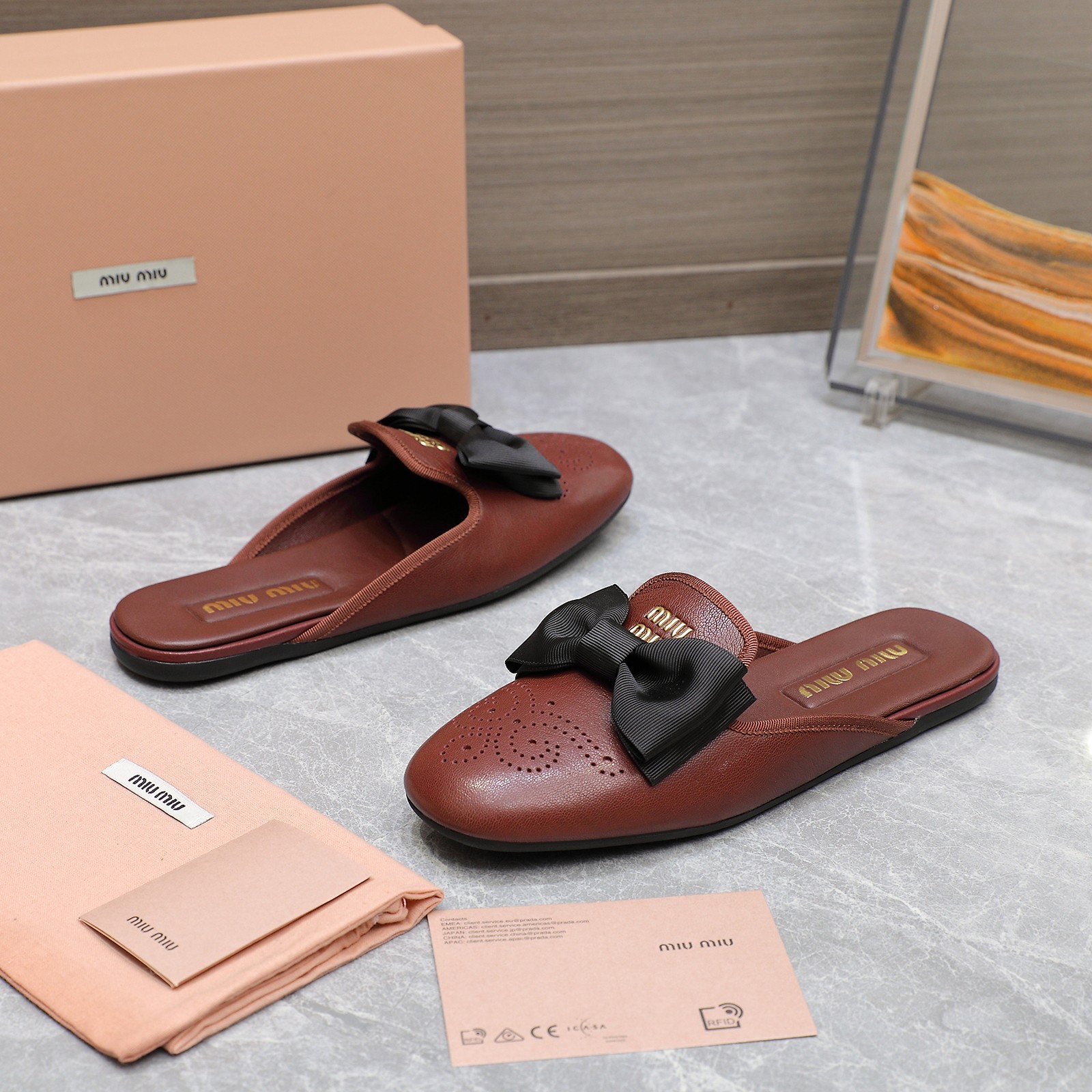 Miu Miu Bow-Embellished Perforated Leather Loafer Mules 5 a1736428854760 1083