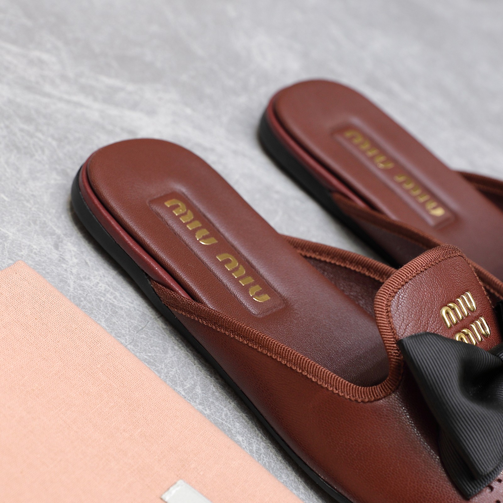 Miu Miu Bow-Embellished Perforated Leather Loafer Mules 8 a1736428854768 3162