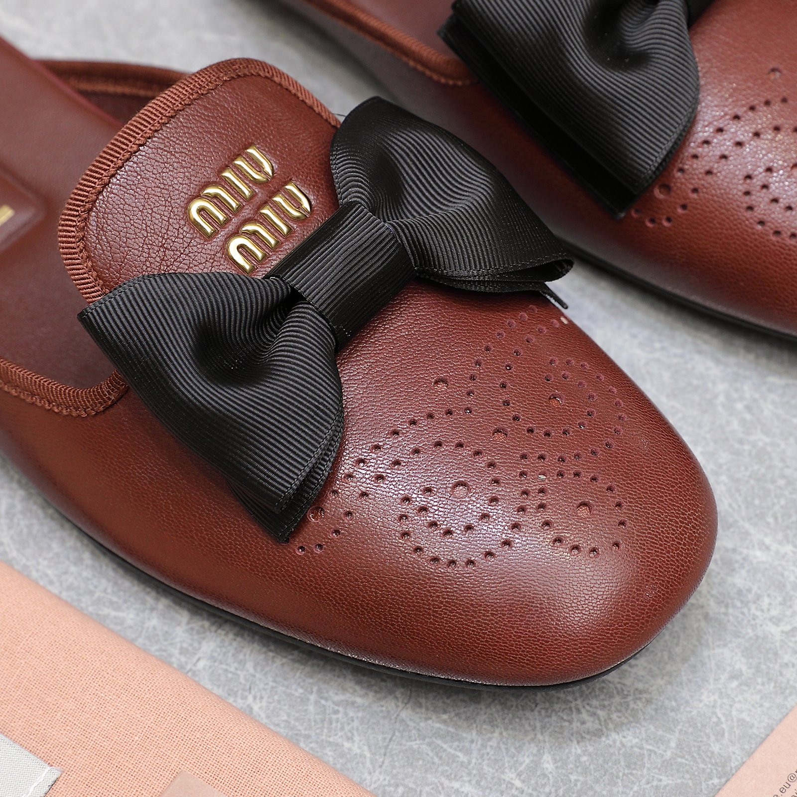 Miu Miu Bow-Embellished Perforated Leather Loafer Mules 6 a1736428854807 2372