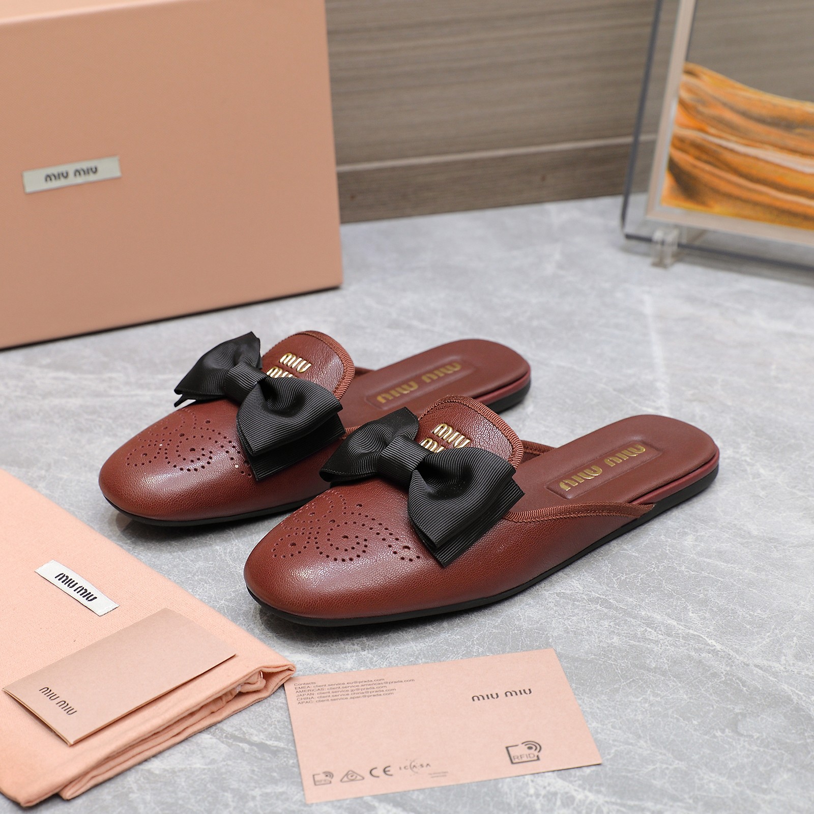 Miu Miu Bow-Embellished Perforated Leather Loafer Mules 4 a1736428854818 0202