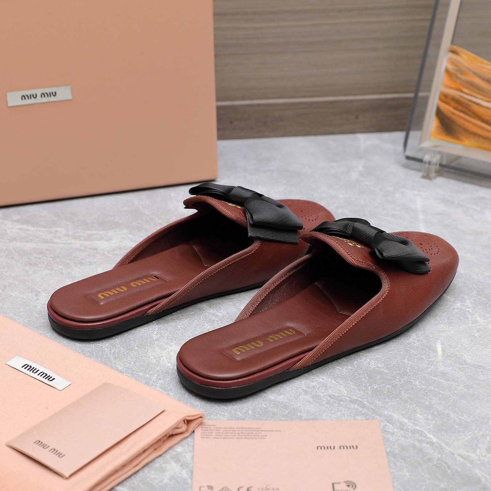 Miu Miu Bow-Embellished Perforated Leather Loafer Mules 7 a1736428854857 0068