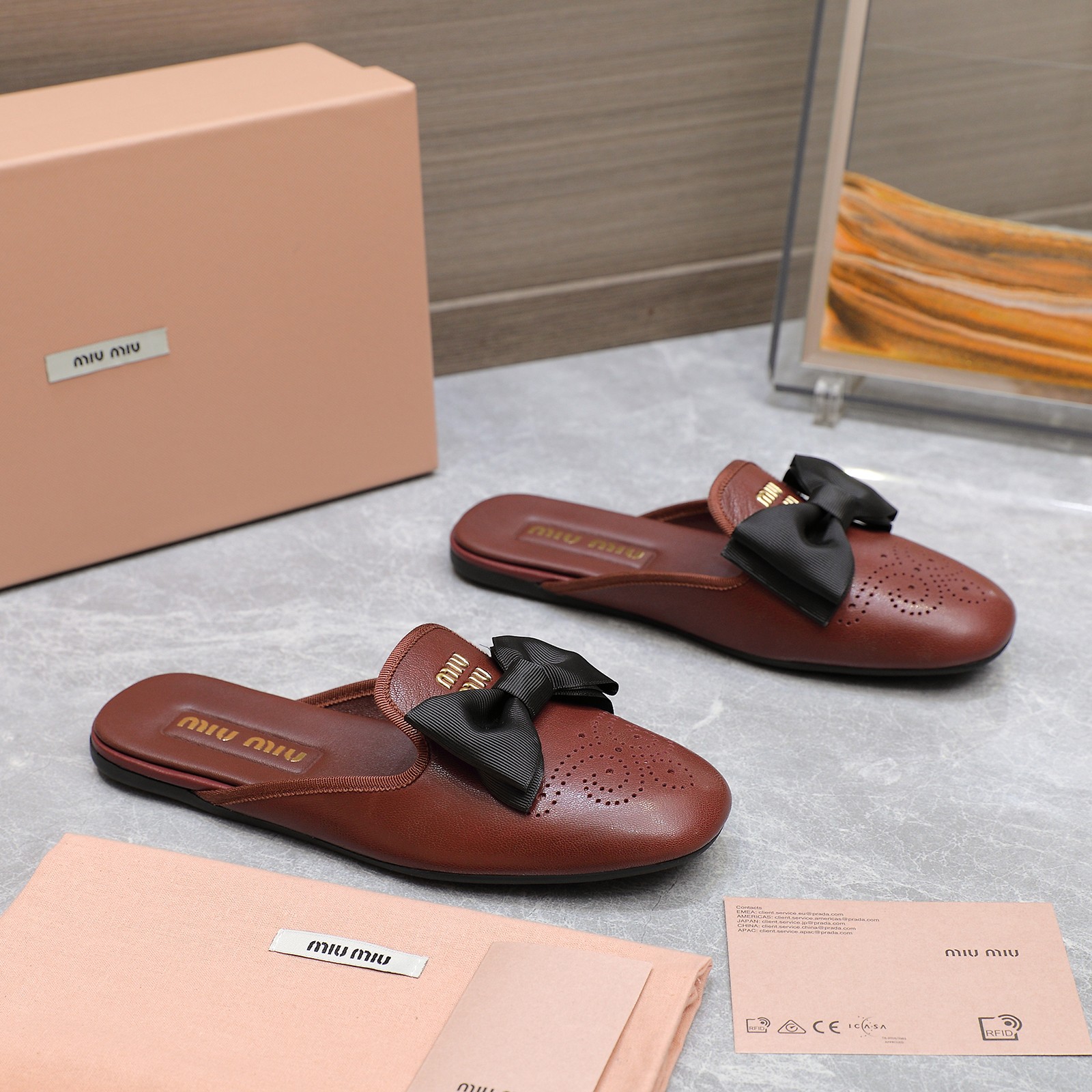 Miu Miu Bow-Embellished Perforated Leather Loafer Mules 9 a1736428856689 0348