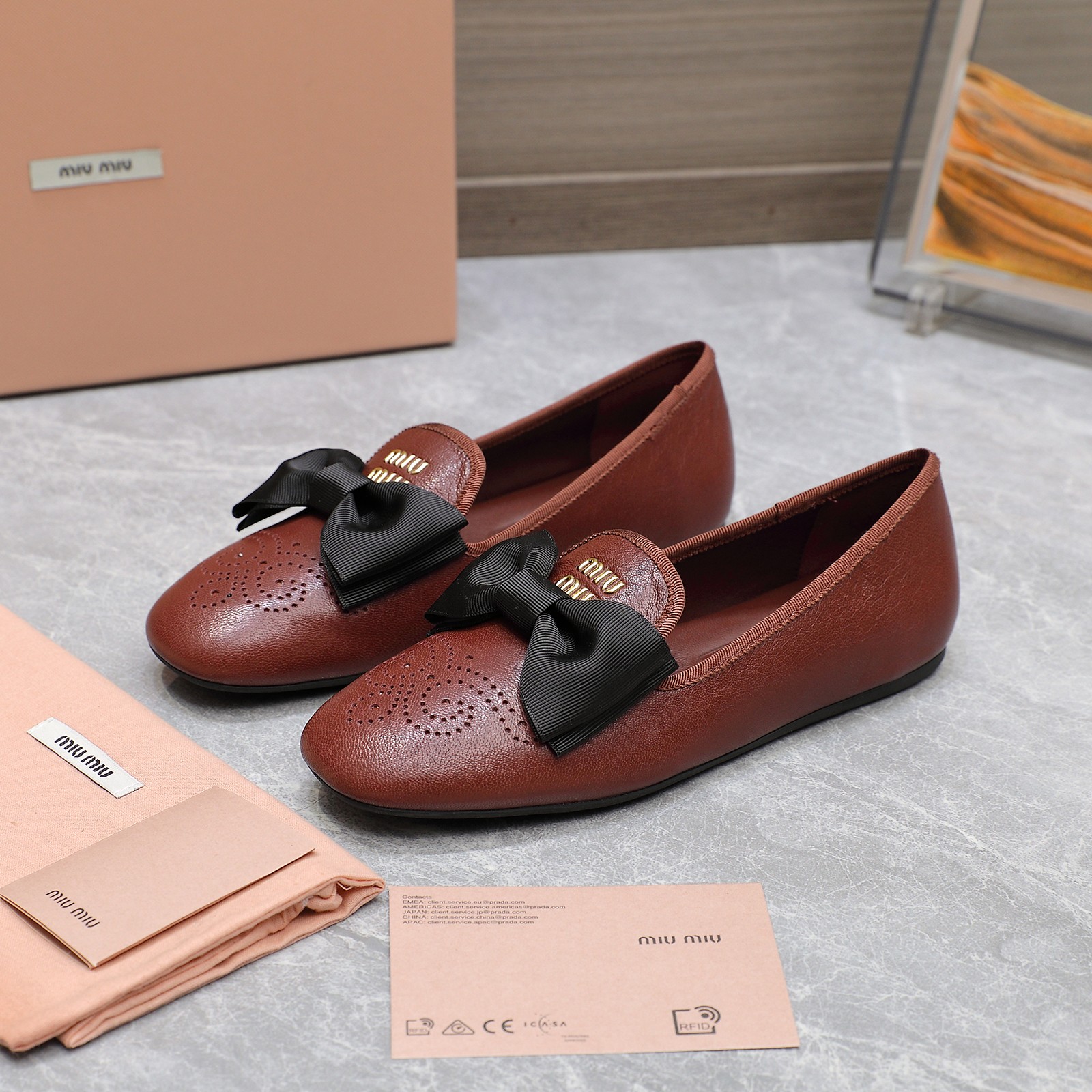 Miu Miu Bow-Embellished Perforated Leather Loafers Ballet Flats 7 a1736429156805 3180