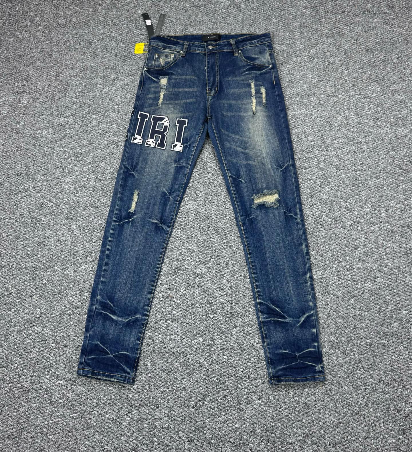 Amiri Men's Distressed Slim Fit Jeans with Embroidered Logo - Stylish Denim
