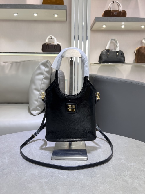 Miu Miu Small Leather Handbag with Embossed Logo - Versatile & Chic