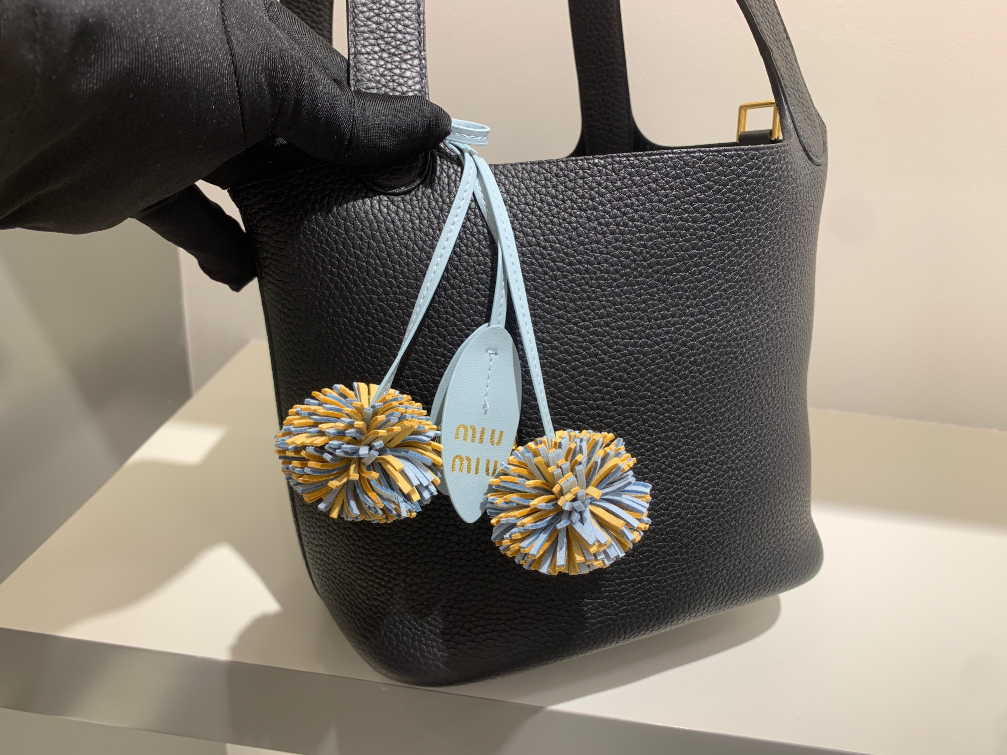 Trend Alert: MiuMiu’s Colorful Accessories in Water Blue and Braided Details