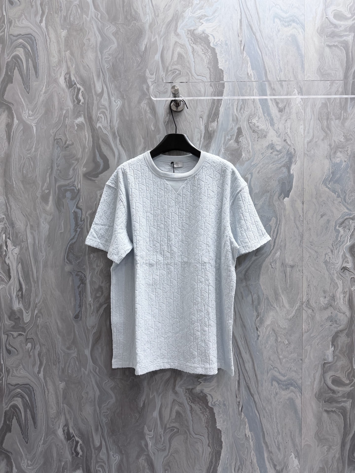 @135Di0r 26 nueva camiseta holgada en tejido de rizo de algodón azul claro Estampado Oblique Esta camiseta blanca en te…