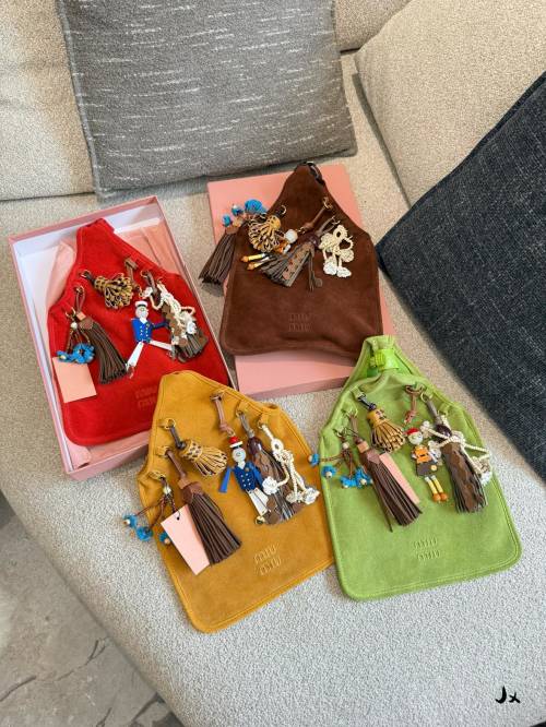 Miu Miu Suede Bag with Robot and Floral Charms - Playful & Artistic 1 Miu Miu Suede Bag with Robot and Floral Charms - Playful & Artistic
