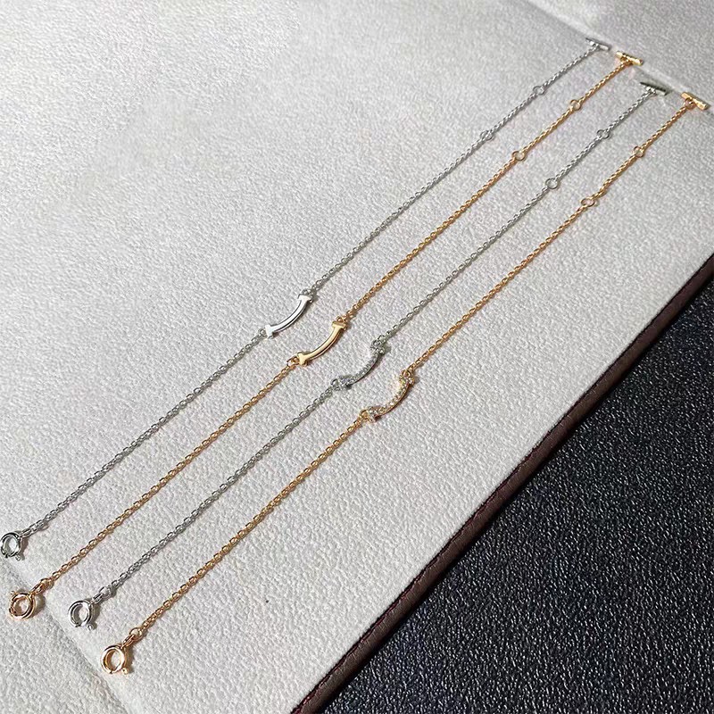 NO:104737,Double T Smile Tiffany Glossy Smiling Bracelet Glossy Diamond Rose Gold Platinum Gold Tiffany is designed with the strongest inspiration for smiling faces. Smile is the most beautiful and confident, and the heart gives off the most sincere charm. Original high-quality zp logo Simple and exquisite trendy people must have., jewelry boutique, tiffany, bracelet, gold19860909双T 微笑蒂芙尼光金笑脸手链光面满钻玫瑰金白金黄金 tiffany以笑脸最强的灵感设计,微笑是一种最美自信,由心发出最真诚魅力.原版 高品质 打造 zp logo 简约精致潮人必备单品.,饰品精品,tiffany,bracelet,gold,Jewelry