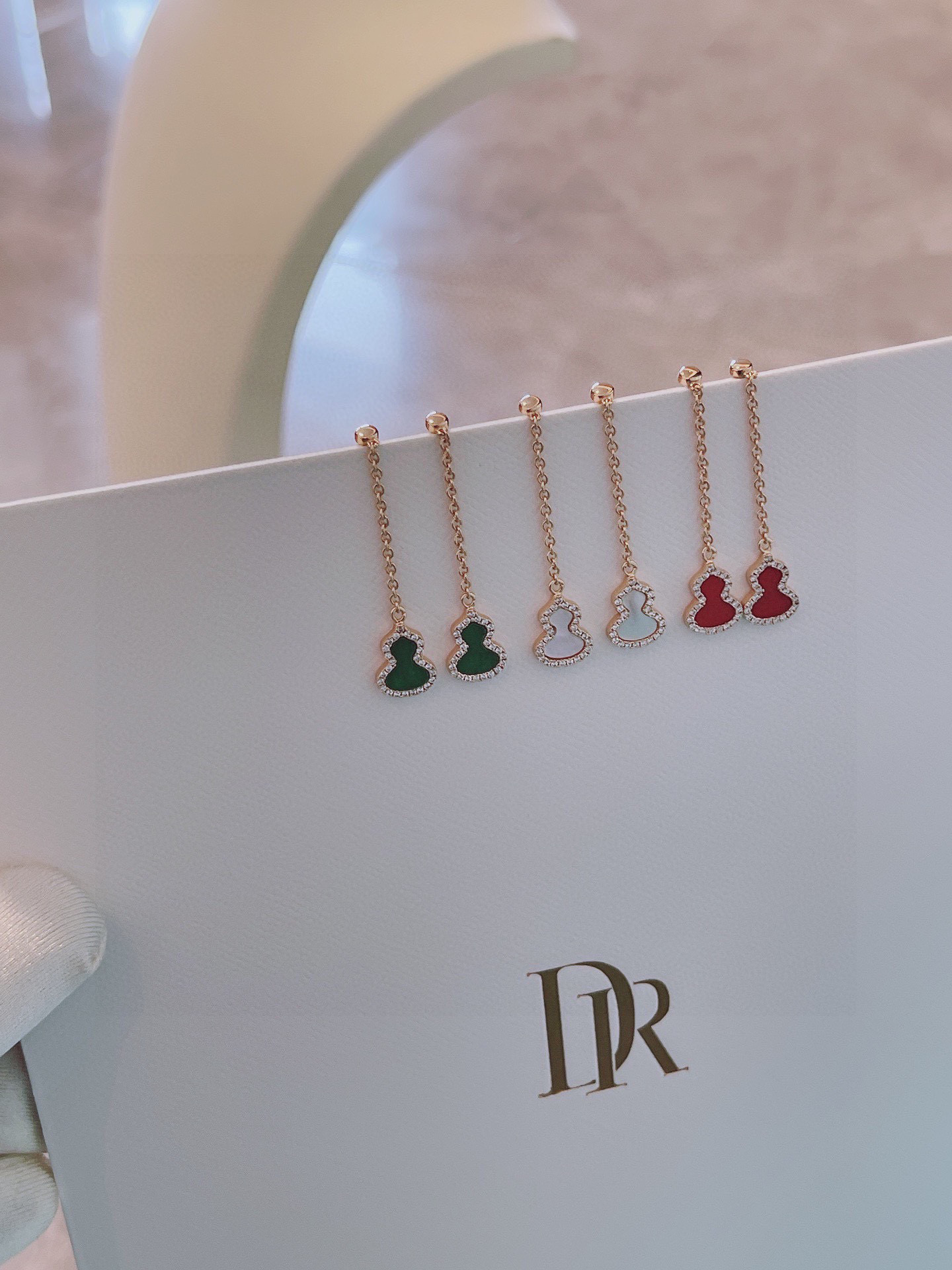 NO:112464,Qeeline Kirin small gourd red agate earrings. The gourd is homophonic with 