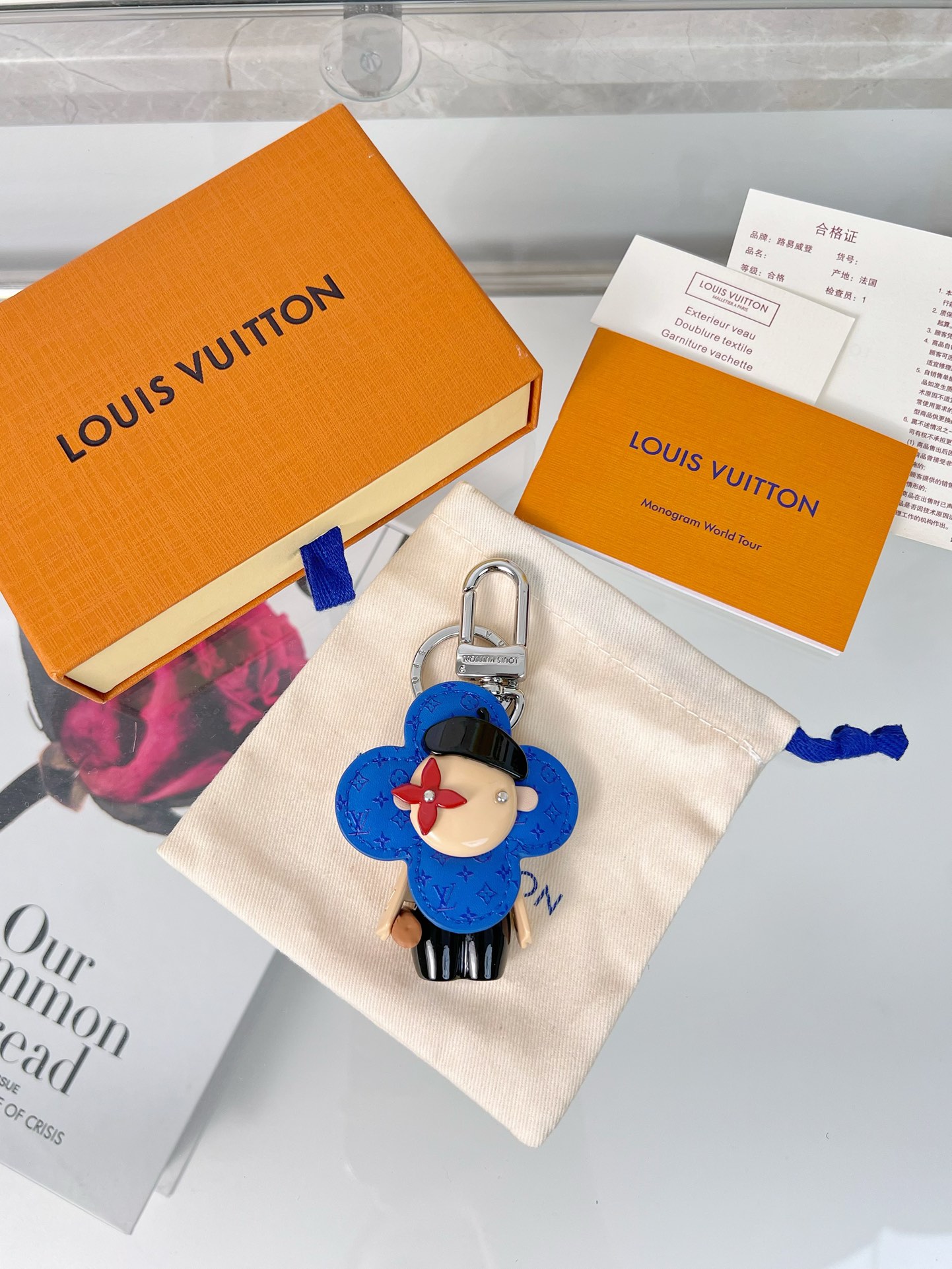 Premium designer keychain with a sun flower charm and gold hardware