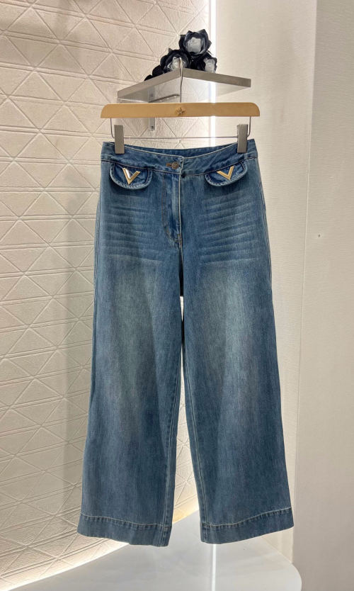 Valentino Women's High-Waisted Wide Leg Jeans in Blue with Metal V Detail 1 Valentino Women's High-Waisted Wide Leg Jeans in Blue with Metal V Detail