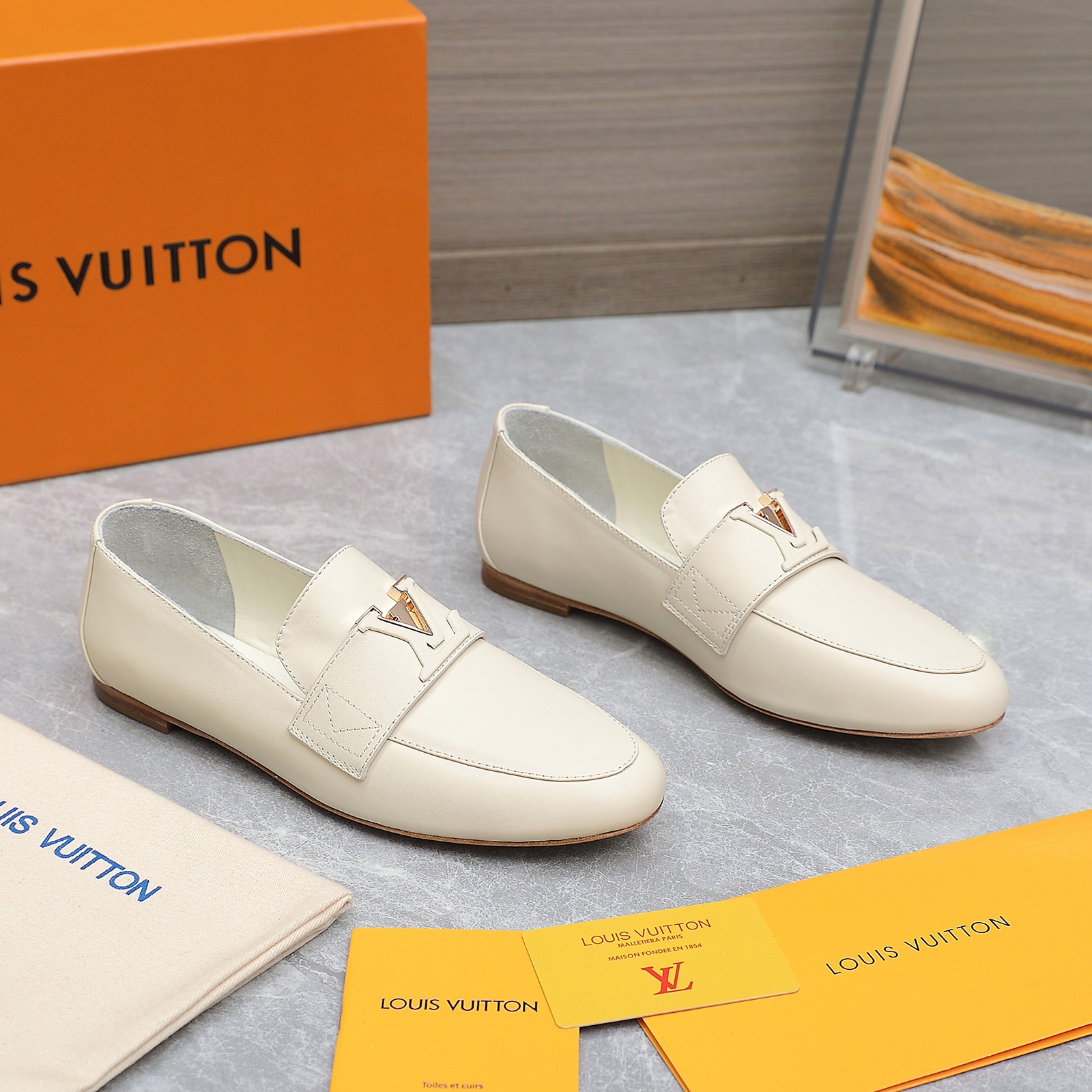 Louis Vuitton Women's Cream Leather Loafers with Signature Buckle Detail 7 a1705306194741 1605