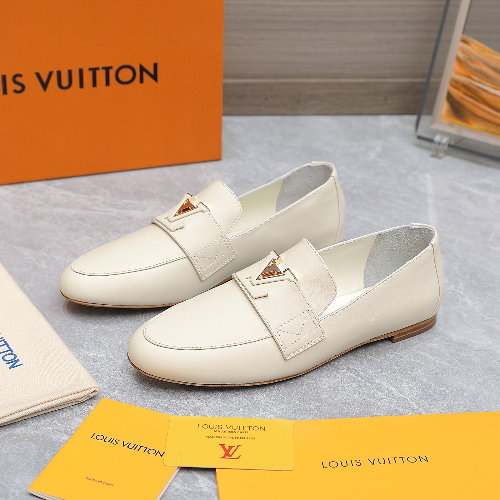 Louis Vuitton Women's Cream Leather Loafers with Signature Buckle Detail 6 a1705306194760 8783