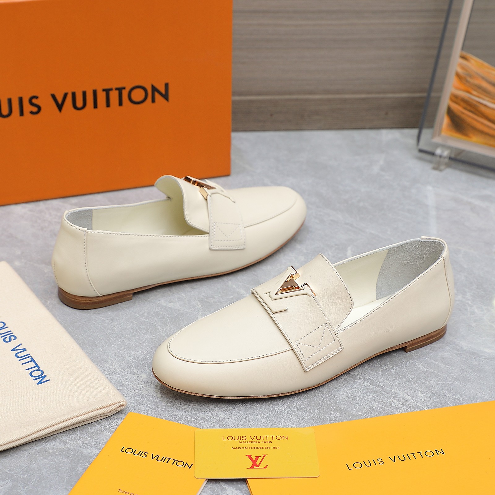 Louis Vuitton Women's Cream Leather Loafers with Signature Buckle Detail 3 a1705306194761 7160