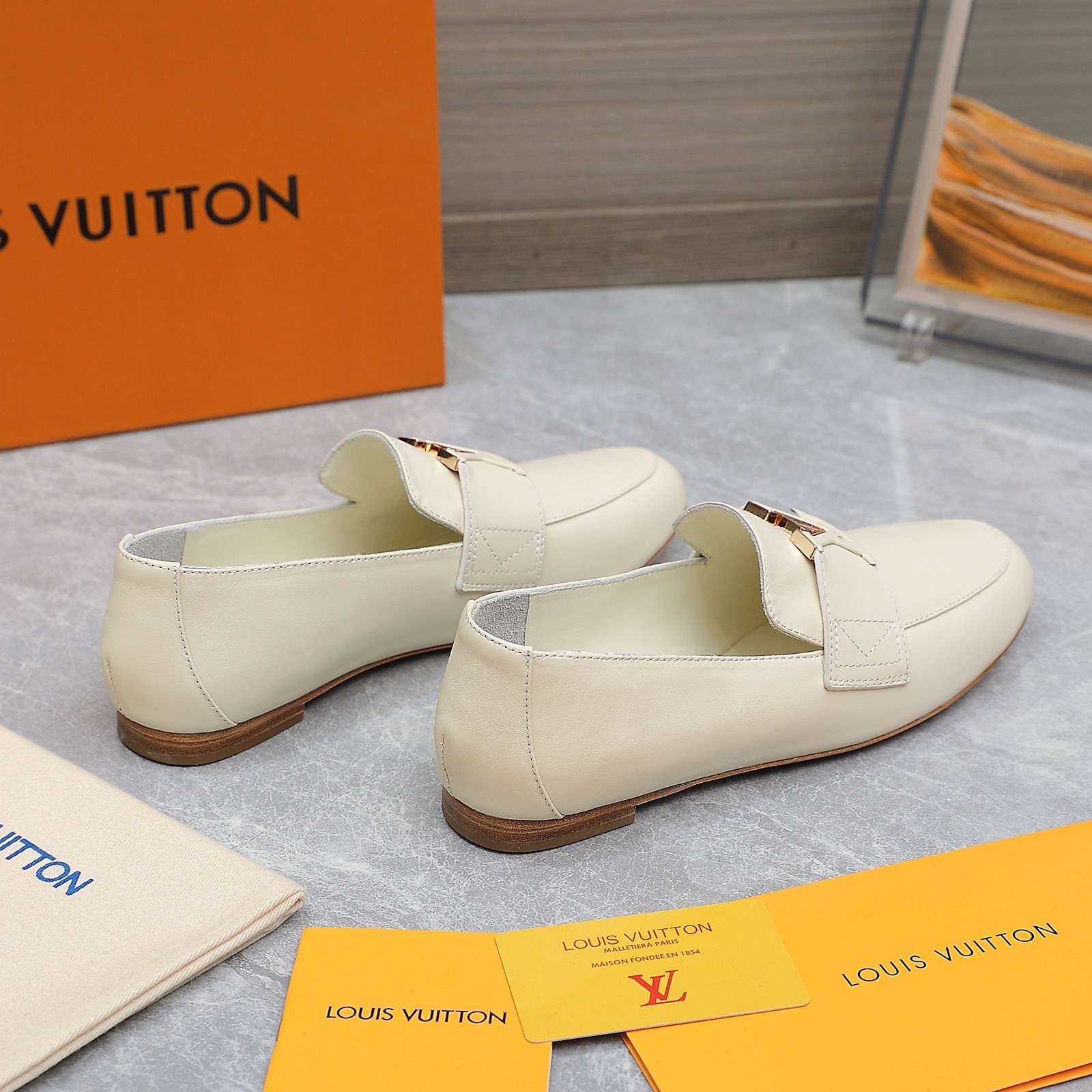 Louis Vuitton Women's Cream Leather Loafers with Signature Buckle Detail 4 a1705306194795 4147