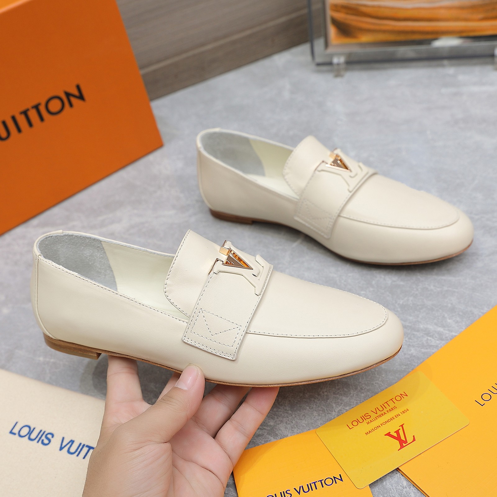 Louis Vuitton Women's Cream Leather Loafers with Signature Buckle Detail 2 a1705306194808 4762