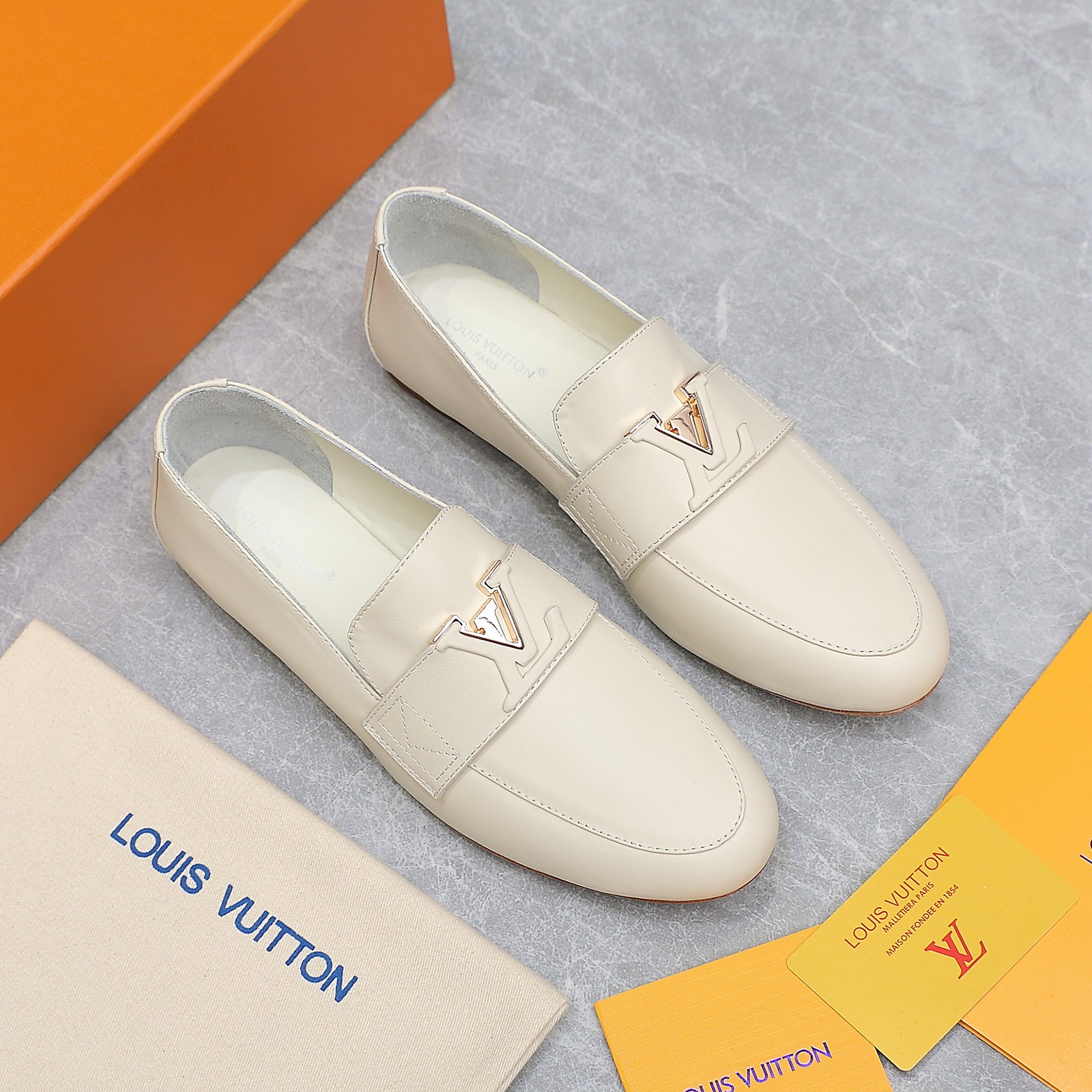 Louis Vuitton Women's Cream Leather Loafers with Signature Buckle Detail 10 a1705306195950 7868
