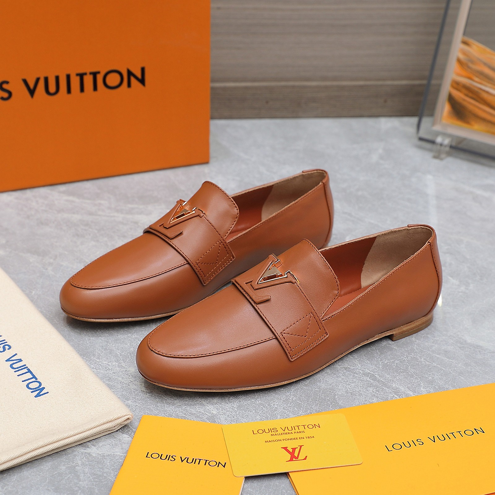 Louis Vuitton Women's Loafers in Brown Leather with Signature Buckle 3 a1705306247177 5155