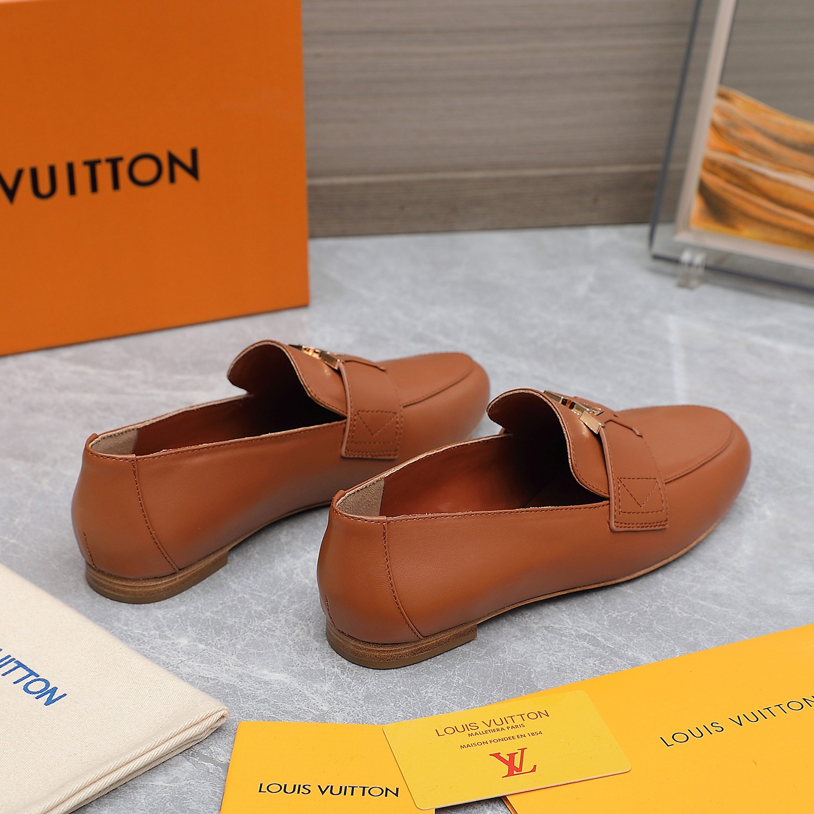 Louis Vuitton Women's Loafers in Brown Leather with Signature Buckle 5 a1705306247179 6232