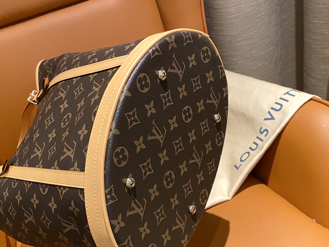 Structured monogram bucket bag featuring precision pattern alignment and - Comprehensive 6