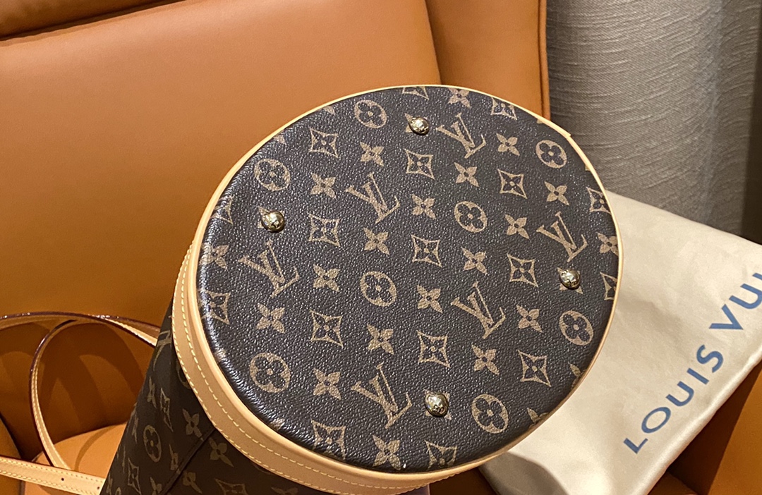 Structured monogram bucket bag featuring precision pattern alignment and - Comprehensive 5