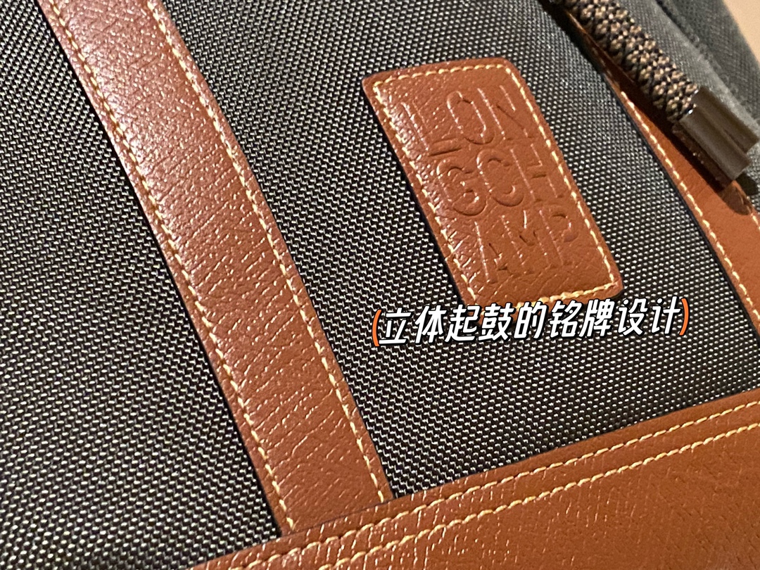 Crafted in canvas with a calfskin leather tab closure, this piece featur - Comprehensive 3