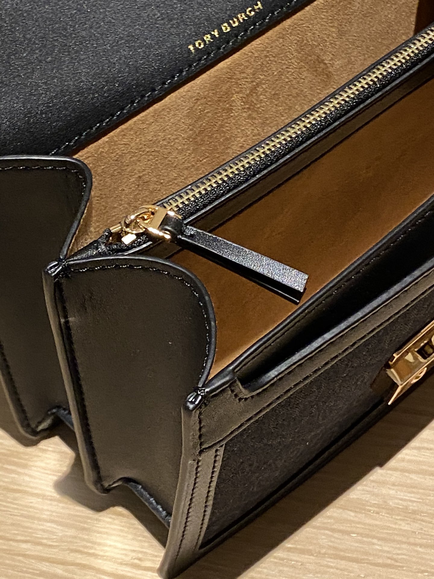 The bag features a full leather interior crafted from two distinct - Comprehensive 6