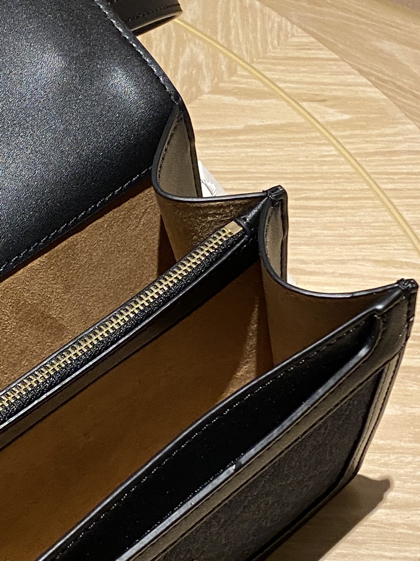 The bag features a full leather interior crafted from two distinct - Comprehensive 3