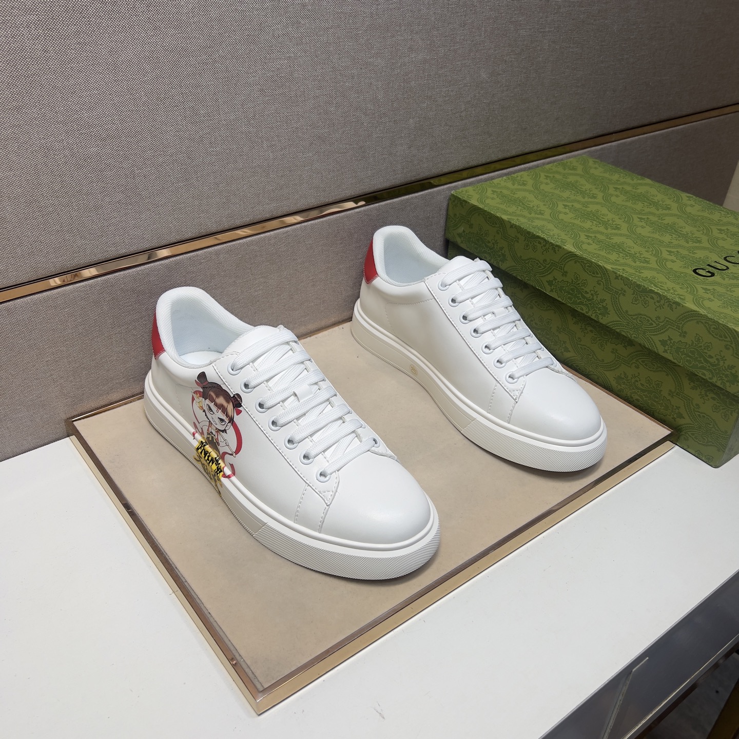 Gucci Men's White Leather Ace Sneaker with Cartoon Character and Red Heel 1 Gucci Men's White Leather Ace Sneaker with Cartoon Character and Red Heel