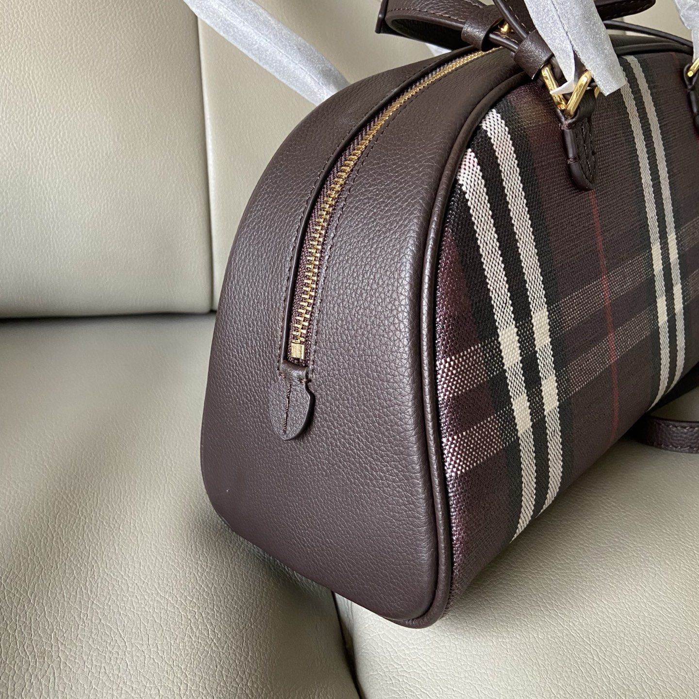 Burberry's Highlands bowling bag debuts in a counter-edition counter, inspired by outdoor design concepts. Crafted in an Italian workshop from co