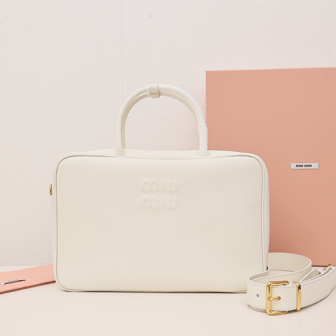 👜Miumiu 2023 New Arrival / Briefcase The Miumiu briefcase is a stylish and practical business bag, with a simple and elegant appearance suitable for various occasions. It has ample space inside to accommodate a 31-inch laptop, phone, wallet, and other daily essentials!!! Can be worn over the shoulder. Material: Imported top-grade cowhide. Size: 34.5cm. Comes in original factory packaging. Color: White. image 1