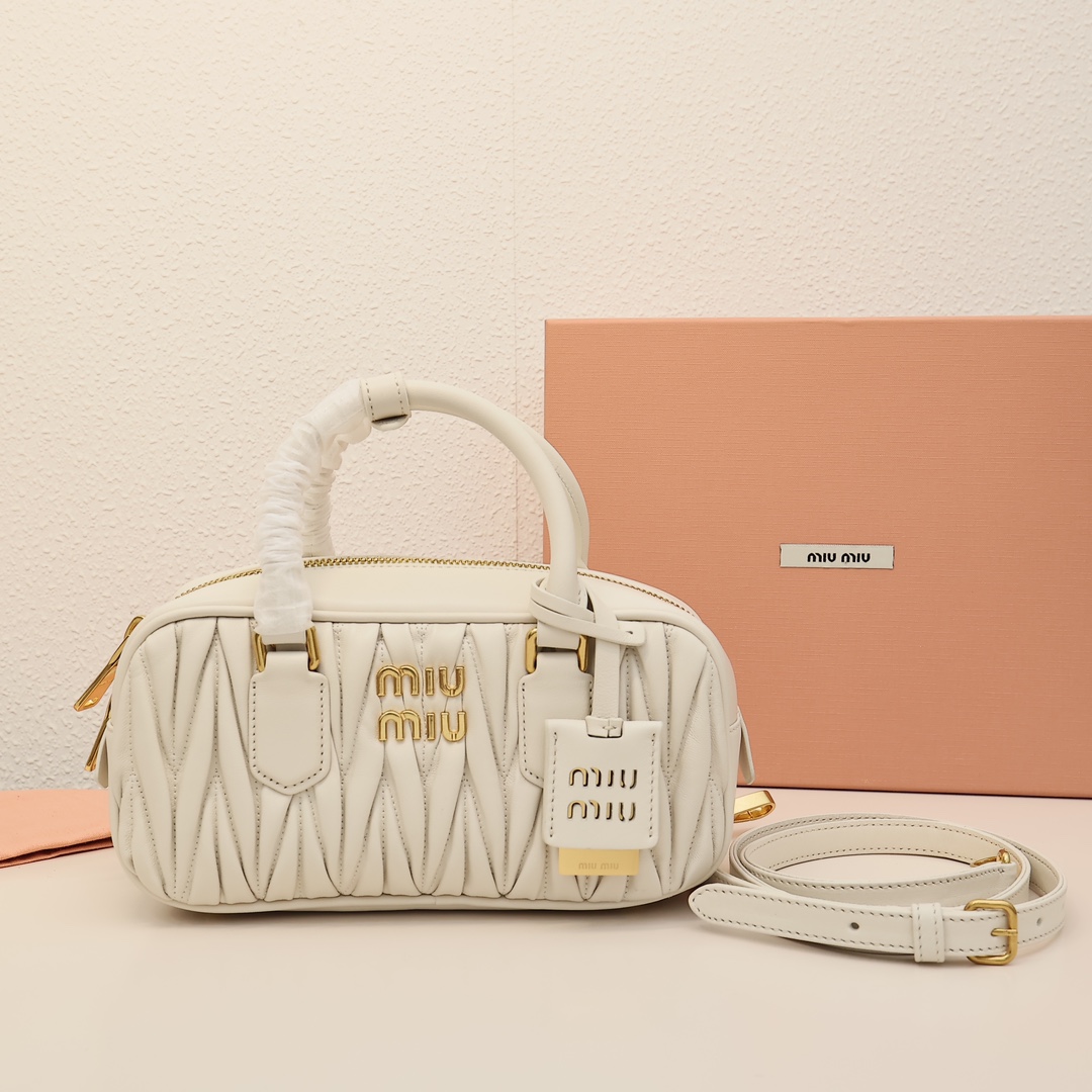 Miumiu pleated bowling bag, versatile and casual, featuring embossed logo, spacious design, suitable for various styles, made of lambskin, perfect for daily commute, simple yet stylish. Material: imported lambskin. Size: small 22cm. Color: white. Comes with original packaging. image 1