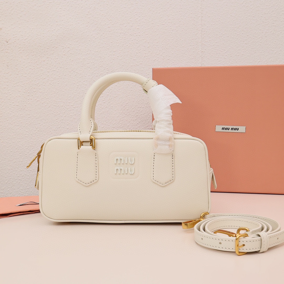 Miumiu bowling bag, versatile and casual, featuring embossed logo and a spacious design. Made with custom cowhide, suitable for any style. Perfect for daily commute with ample capacity. Simple yet sophisticated. Material: imported cowhide. Size: small 22cm. Color: white. Comes with original packaging. image 1